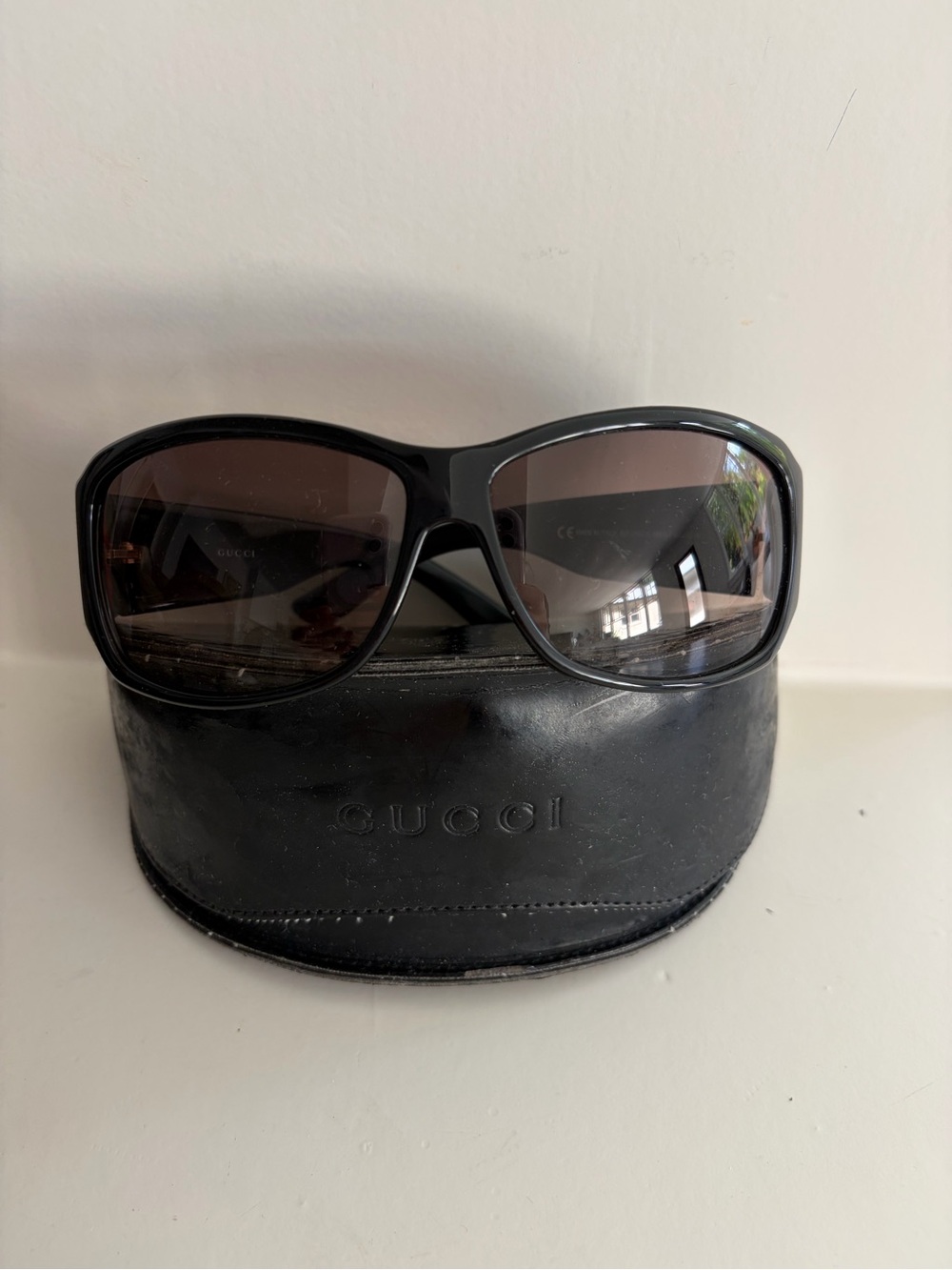Gucci Black Frame Sunglasses with Brown Lenses